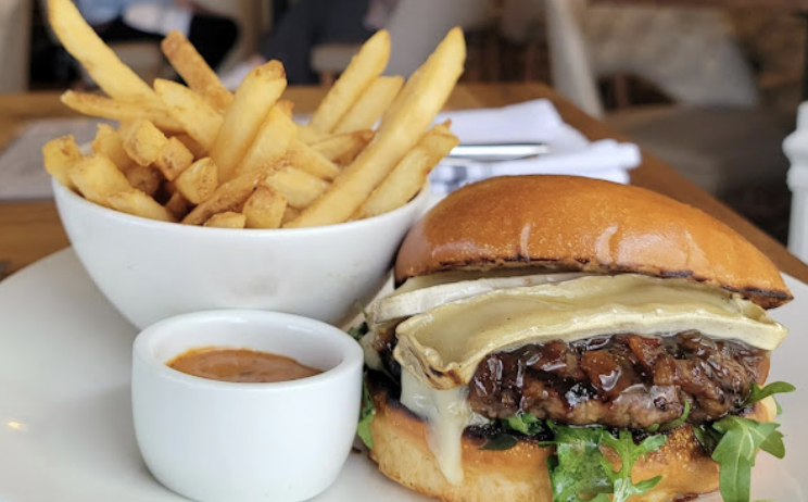 Bella Cafe and Grille at Chevy Chase signature dishes Classic BurgerCrispy Chicken SaladBolognese